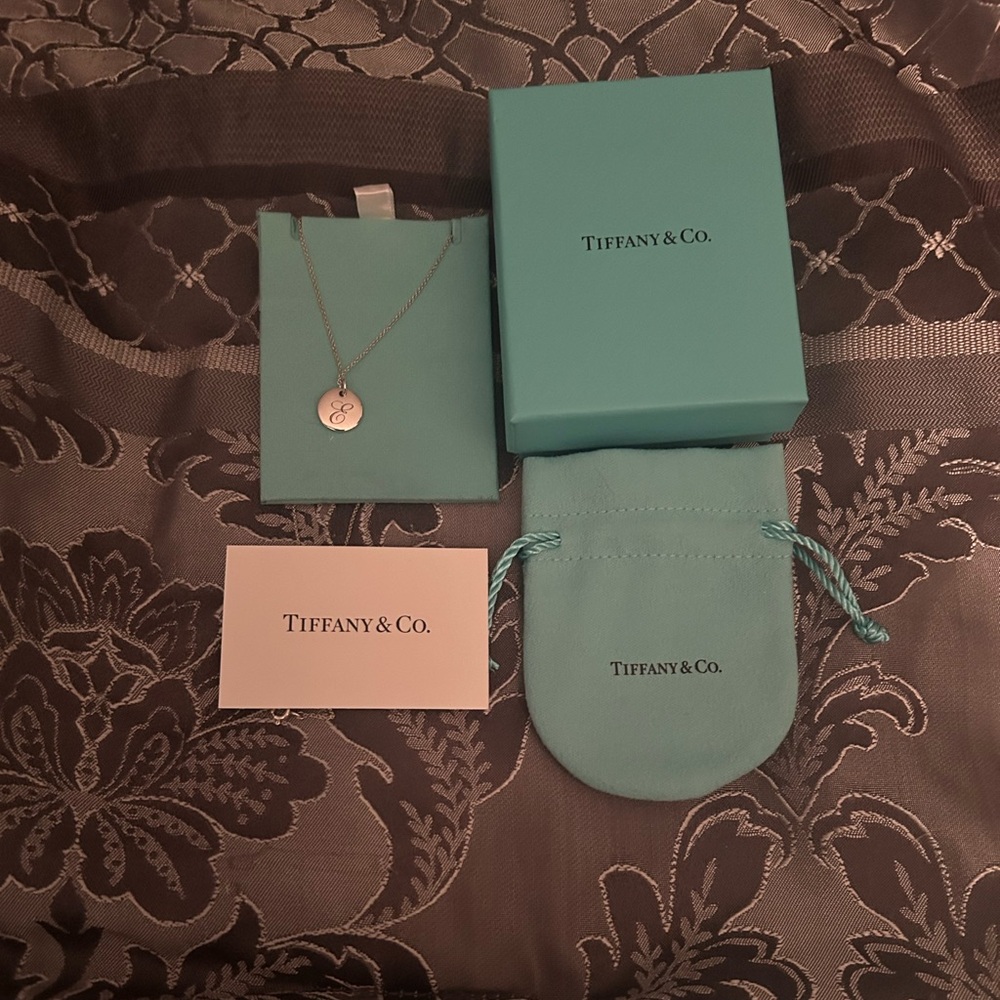 Tiffany & Co. Silver Initial “E” Charm Necklace with original packaging